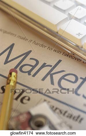 Pencil, financial section of newspaper and computer keyboard, close-up View Large Photo Image Picture - Pencil, financial section of newspaper and computer keyboard, close-up. Fotosearch