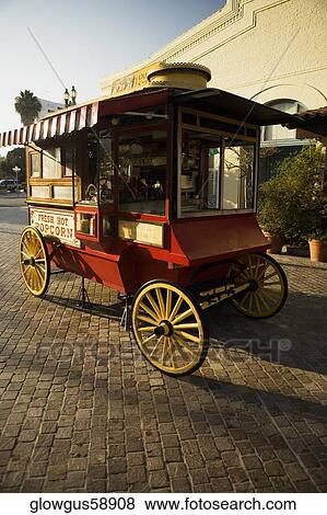 Popcorn cart parked on a street side View Large Photo Image Stock Photo - Popcorn cart parked on a street side. Fotosearch