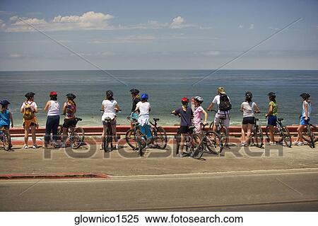 Rear view of a group of cyclists looking at the Pacific Ocean, La Jolla, San Diego, California, USA View Large Photo Image Stock Photography - Rear view of a group of cyclists looking at the Pacific Ocean, La Jolla, San Diego, California, USA. Fotosearch