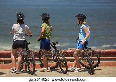 Rear view of a group of cyclists looking at the Pacific Ocean, La Jolla, San Diego, California, USA View Large Photo Image Stock Photography - Rear view of a group of cyclists looking at the Pacific Ocean, La Jolla, San Diego, California, USA. Fotosearch