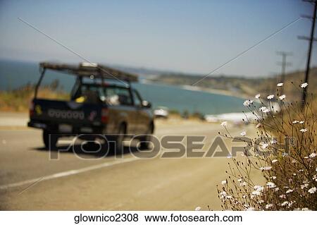 Stock Photo - Rear view of a truck on a road. Fotosearch