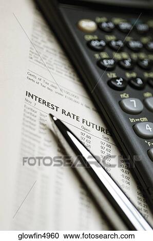 Scientific calculator, pen and list of interest rates, close-up View Large Photo Image Stock Image - Scientific calculator, pen and list of interest rates, close-up. Fotosearch