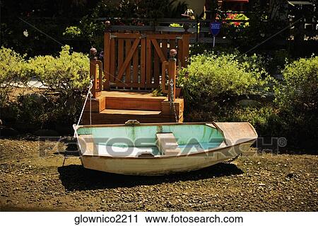 Side profile of a rowboat on a shore View Large Photo Image Stock Image - Side profile of a rowboat on a shore. Fotosearch