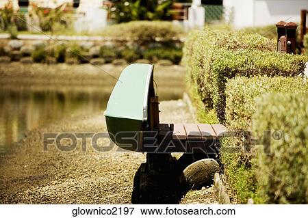Side profile of a rowboat on a shore View Large Photo Image Stock Photo - Side profile of a rowboat on a shore. Fotosearch