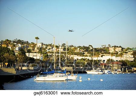 Side profile of yacht's docked at a harbor, San Diego Bay, California, USA View Large Photo Image Stock Image - Side profile of yacht's docked at a harbor, San Diego Bay, California, USA. Fotosearch