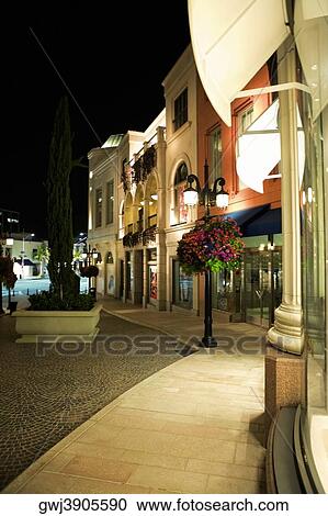 Stock Image - Sidewalk of Rodeo Drive at night, Los Angeles, California, USA. Fotosearch