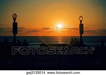 Silhouette of people on the beach at dusk, San Diego, California, USA View Large Photo Image Picture - Silhouette of people on the beach at dusk, San Diego, California, USA. Fotosearch