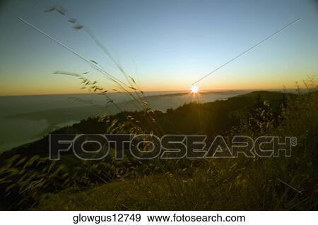 Stock Photo - Sunset over the sea. Fotosearch