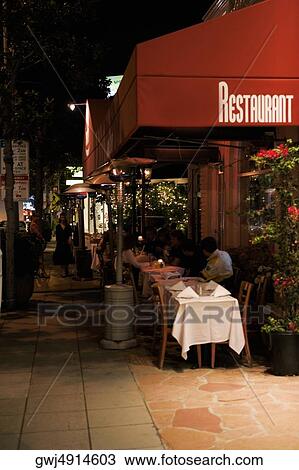 Tables and chairs set up at an outdoor cafe, Los Angeles, California, USA View Large Photo Image Stock Image - Tables and chairs set up at an outdoor cafe, Los Angeles, California, USA. Fotosearch