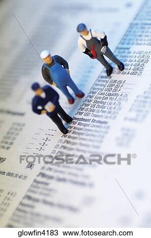 Three toy men standing on top of stock market report View Large Photo Image Stock Image - Three toy men standing on top of stock market report. Fotosearch