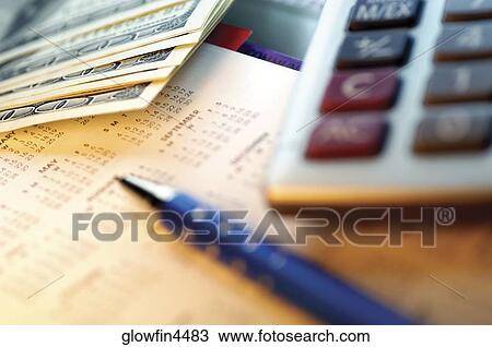 United States currency, pen and calculator on top of calendar, close-up View Large Photo Image Stock Image - United States currency, pen and calculator on top of calendar, close-up. Fotosearch