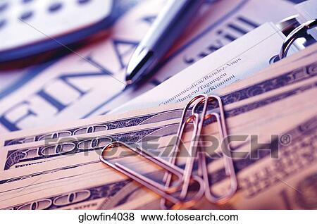 United States currency, pen, spiral notebook, planning list, financial section of newspaper and calculator, close-up View Large Photo Image Stock Photo - United States currency, pen, spiral notebook, planning list, financial section of newspaper and calculator, close-up. Fotosearch