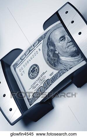 Stock Photography - United States one hundred dollar bill in container, close-up. Fotosearch