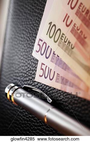 Various Euro bank notes with pen on top of wallet, close-up View Large Photo Image Stock Photography - Various Euro bank notes with pen on top of wallet, close-up. Fotosearch