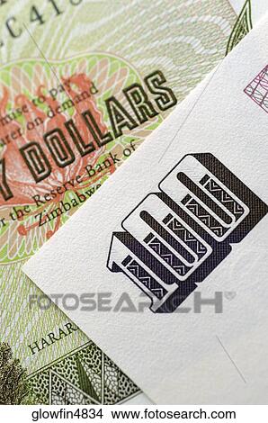 Zimbabwe bank note and paper with number 100, close-up View Large Photo Image Picture - Zimbabwe bank note and paper with number 100, close-up. Fotosearch