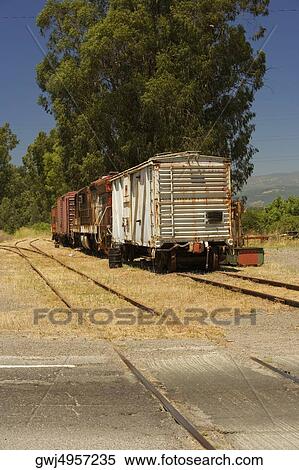 Abandoned freight train on railroad track View Large Photo Image Stock Photography - Abandoned freight train on railroad track. Fotosearch