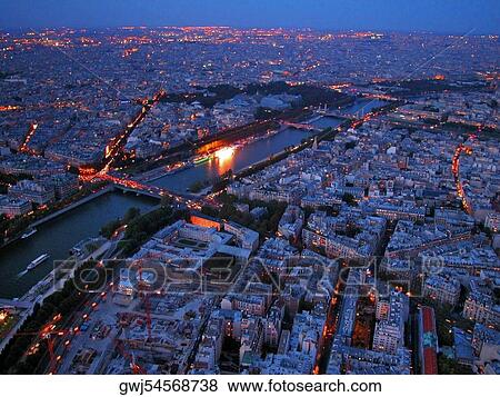 Aerial view of a city at dusk, Paris, France View Large Photo Image Stock Photo - Aerial view of a city at dusk, Paris, France. Fotosearch