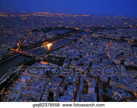 Aerial view of city at dusk, Paris, France View Large Photo Image Stock Photo - Aerial view of city at dusk, Paris, France. Fotosearch