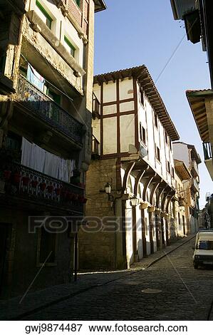 Alleyway passing through a town, Spain View Large Photo Image Stock Photo - Alleyway passing through a town, Spain. Fotosearch