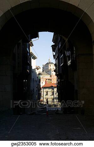 Alleyway passing through an arched gateway, Spain View Large Photo Image Stock Photography - Alleyway passing through an arched gateway, Spain. Fotosearch