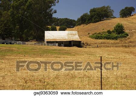 Barn in a field View Large Photo Image Stock Photo - Barn in a field. Fotosearch