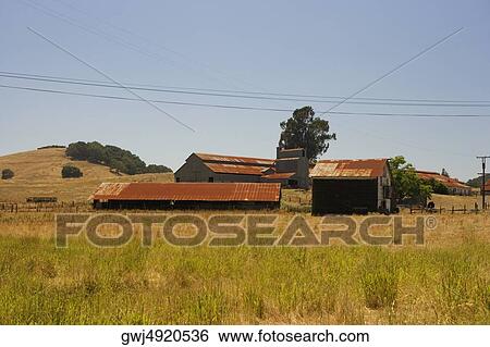 Barn in a field View Large Photo Image Stock Photograph - Barn in a field. Fotosearch