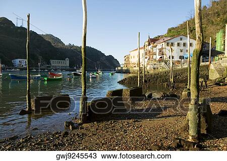 Stock Image - Boats moored at a dock, Spain. Fotosearch