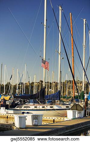 Boats moored at a harbor View Large Photo Image Stock Photography - Boats moored at a harbor. Fotosearch