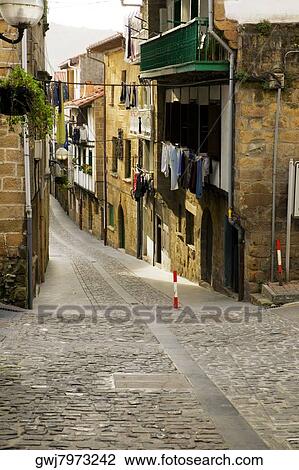 Building on both sides of an alleyway, Spain View Large Photo Image Stock Image - Building on both sides of an alleyway, Spain. Fotosearch