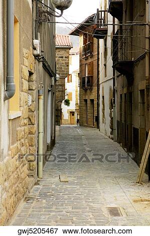 Building on both sides of an alleyway, Spain View Large Photo Image Stock Photo - Building on both sides of an alleyway, Spain. Fotosearch