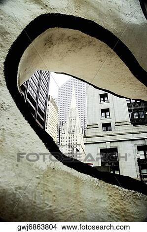 Building viewed through a hole in a modern sculpture, Chicago, Illinois, USA View Large Photo Image Picture - Building viewed through a hole in a modern sculpture, Chicago, Illinois, USA. Fotosearch