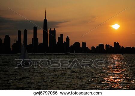 Buildings on a waterfront at sunset, Chicago, Illinois, USA View Large Photo Image Stock Photograph - Buildings on a waterfront at sunset, Chicago, Illinois, USA. Fotosearch