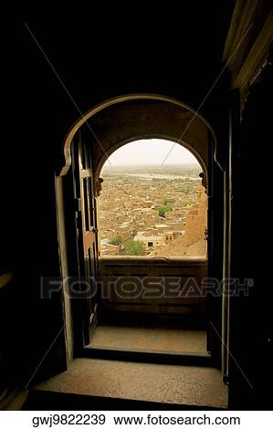 City seen through a window, Rajmahal, Jaisalmer, Rajasthan, India View Large Photo Image Stock Photo - City seen through a window, Rajmahal, Jaisalmer, Rajasthan, India. Fotosearch