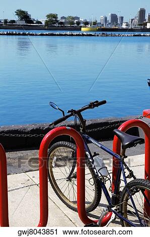 Close-up of a bicycle parked at bicycle rack, Lake Michigan, Chicago, Illinois, USA View Large Photo Image Stock Image - Close-up of a bicycle parked at bicycle rack, Lake Michigan, Chicago, Illinois, USA. Fotosearch