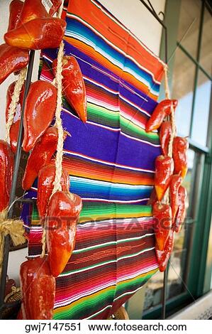 Close-up of a blanket hanging in the middle of artificial chilies, San Diego, California, USA View Large Photo Image Stock Image - Close-up of a blanket hanging in the middle of artificial chilies, San Diego, California, USA. Fotosearch