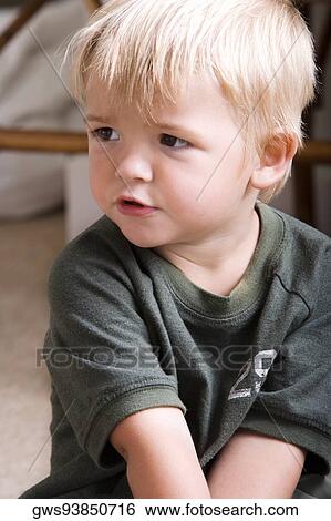 Close-up of a boy sitting View Large Photo Image Stock Photograph - Close-up of a boy sitting. Fotosearch