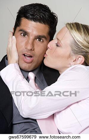 Close-up of a businesswoman kissing a businessman View Large Photo Image Stock Photo - Close-up of a businesswoman kissing a businessman. Fotosearch