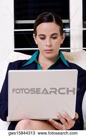 Close-up of a businesswoman using a laptop View Large Photo Image Stock Image - Close-up of a businesswoman using a laptop. Fotosearch