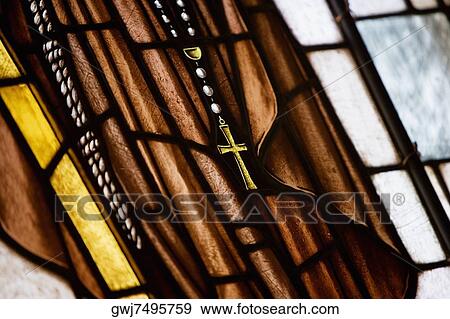 Close-up of a cross on a stained glass window View Large Photo Image Stock Photo - Close-up of a cross on a stained glass window. Fotosearch