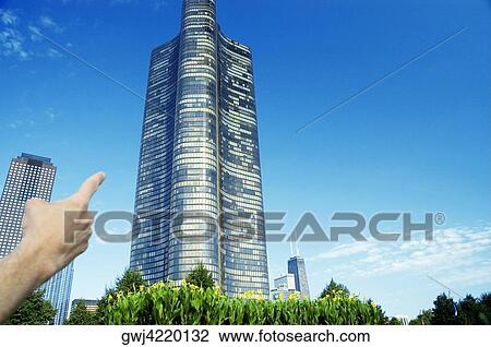 Close-up of a human hand pointing to a building, Lake Point Tower, Chicago, Illinois, USA View Large Photo Image Stock Image - Close-up of a human hand pointing to a building, Lake Point Tower, Chicago, Illinois, USA. Fotosearch