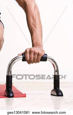 Close-up of a person's hand holding exercising equipment View Large Photo Image Stock Image - Close-up of a person's hand holding exercising equipment. Fotosearch