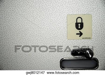 Close-up of an airplane lavatory lock and symbol View Large Photo Image Stock Photo - Close-up of an airplane lavatory lock and symbol. Fotosearch