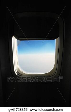 Close-up of an airplane window View Large Photo Image Stock Photograph - Close-up of an airplane window. Fotosearch