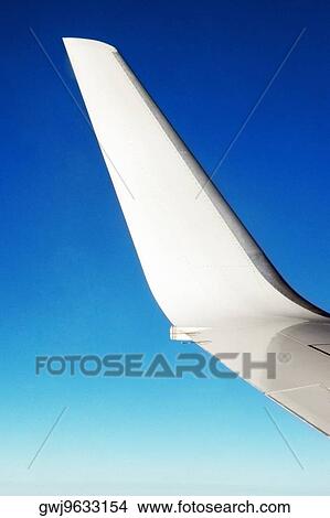 Close-up of an airplane wing in flight View Large Photo Image Picture - Close-up of an airplane wing in flight. Fotosearch