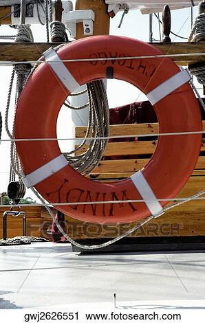 Close-up of an orange life belt on a yacht View Large Photo Image Stock Image - Close-up of an orange life belt on a yacht. Fotosearch