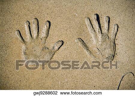 Stock Image - Close-up of handprints in cement at a theater, Mann's Chinese Theater, Los Angeles, California, USA. Fotosearch
