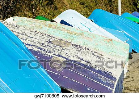 Stock Photography - Close-up of rowing boats upturned on the wall, Spain. Fotosearch