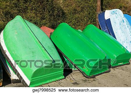 Close-up of rowing boats upturned on the wall, Spain View Large Photo Image Stock Photography - Close-up of rowing boats upturned on the wall, Spain. Fotosearch