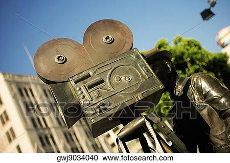 Stock Image - Close-up of the statue of a filmmaker, Los Angeles, California, USA. Fotosearch