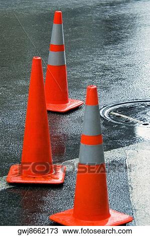 Close-up of traffic cones on a road View Large Photo Image Stock Image - Close-up of traffic cones on a road. Fotosearch